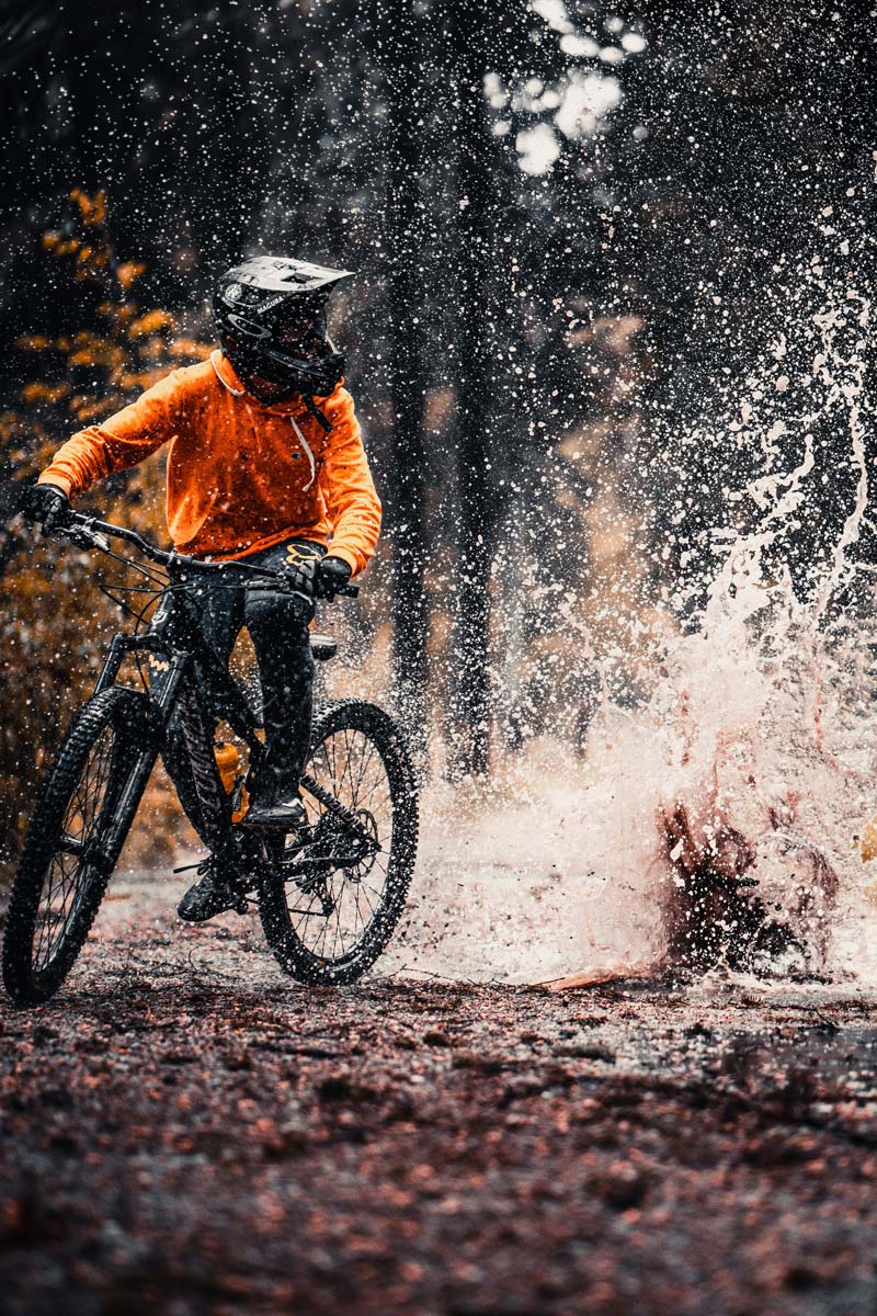 Photo of a person riding a mountain bike on a trail